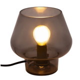 Modern table lamp with smoked glass shade and visible bulb for ambient lighting in living spaces