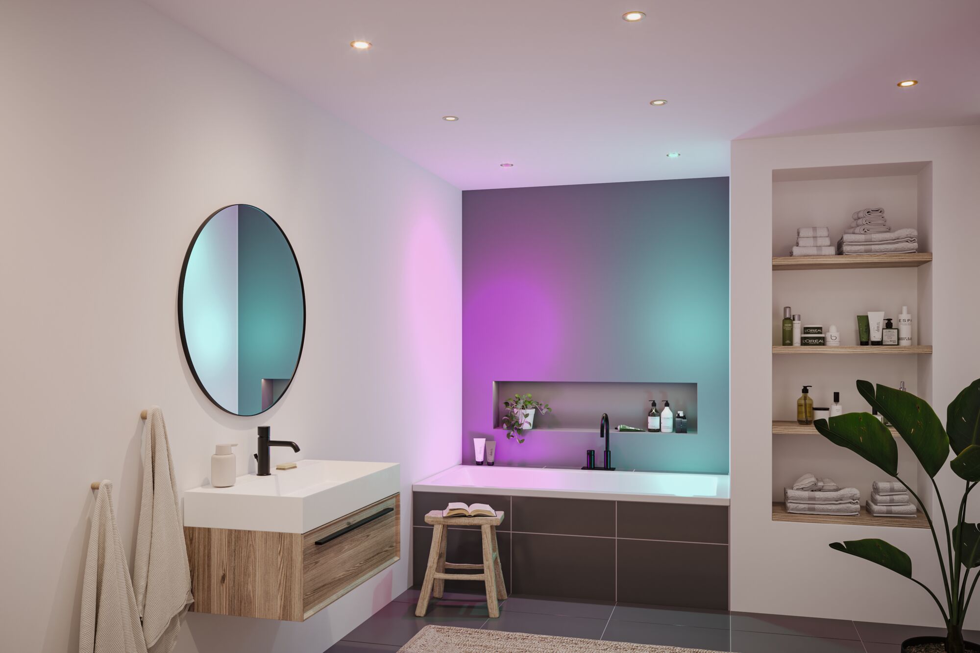 Modern bathroom with wooden vanity, round mirror, and bathtub featuring colorful LED lighting