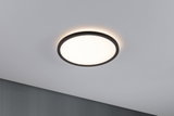 Round LED ceiling light with black frame and warm white light for modern living spaces