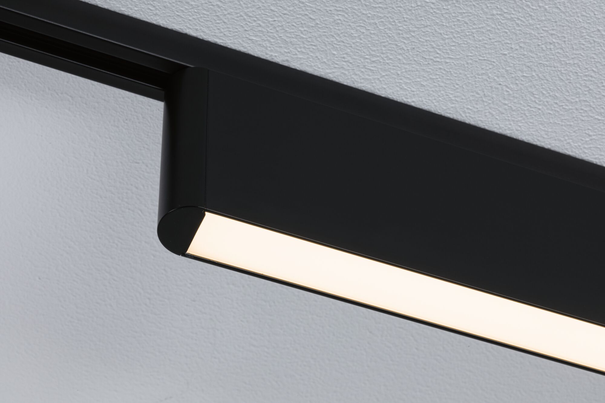 Black metal LED ceiling light with warm white illumination for modern interiors