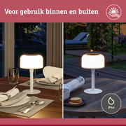 Witte tafellamp met ronde kunststof kap, geschikt voor binnen- en buitengebruik met IP44 bescherming