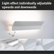 White adjustable metal wall light with upward and downward light effect for modern interiors