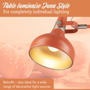Red metal Juna Style table lamp with gold interior for customizable lighting solutions
