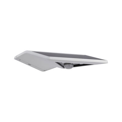 White solar outdoor wall light with motion sensor and black solar panel surface for energy-saving lighting