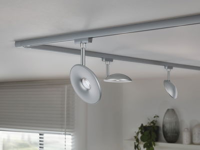 Modern ceiling light with three silver LED spotlights on track system for living spaces.