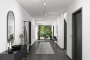 Moderner Flur mit weißen Wänden, grauem Boden, schwarzer Garderobe und Deckenstrahlern für Wohnraumbeleuchtung