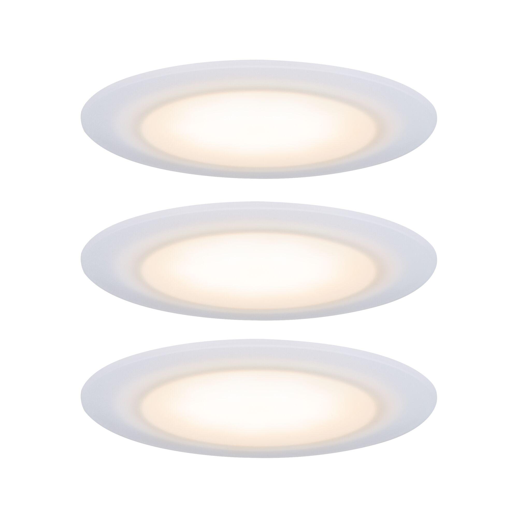 Round white LED recessed light set with warm white glow for modern interior lighting