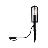 Black outdoor lamp with clear glass and visible LED candle bulb, weatherproof garden light with ground spike