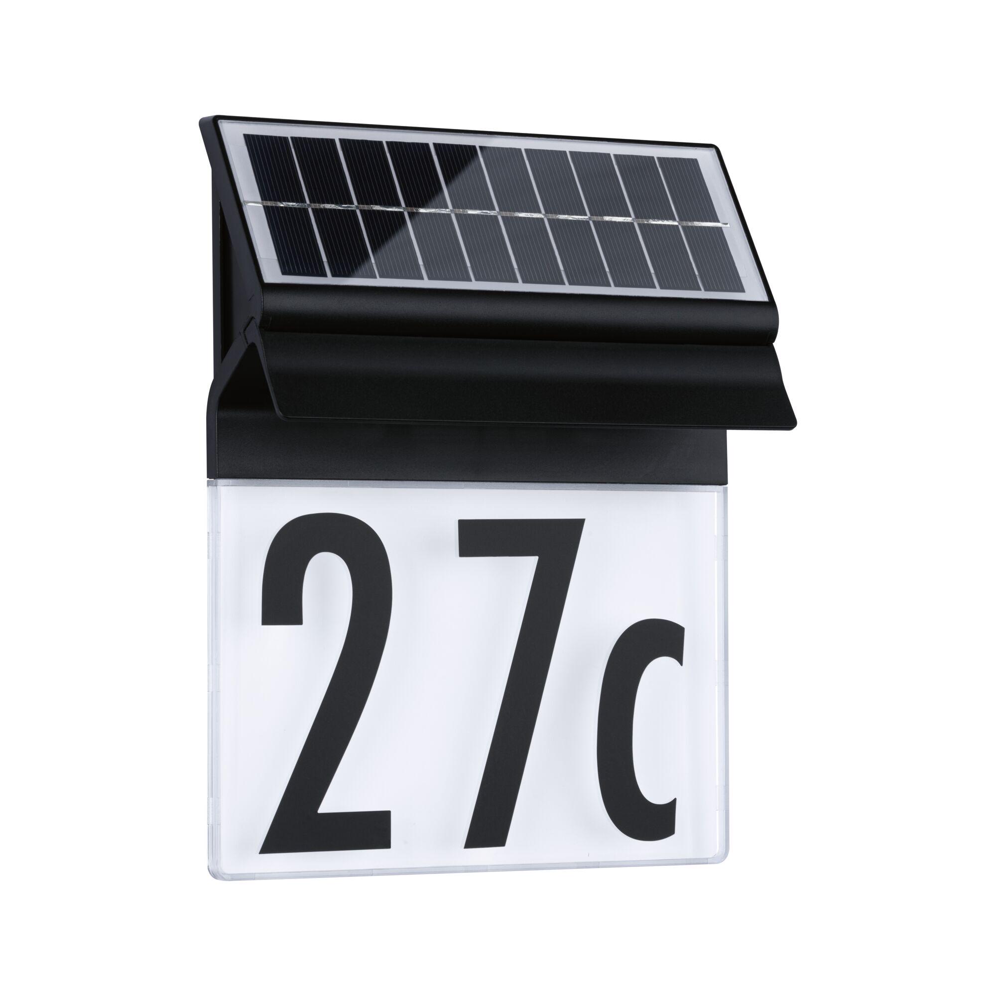 Black solar panel on house number light with white background and black digits for outdoor use