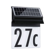 Panneau solaire noir sur lampe de numéro de maison avec fond blanc et chiffres noirs
