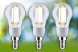 Three clear glass LED bulbs with E14 base emitting warm white light for energy-efficient lighting