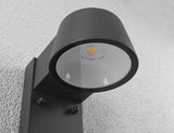 Black metal LED outdoor wall light with round glass, modern design for exterior lighting