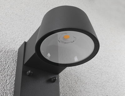 Black metal LED outdoor wall light with round glass, modern design for exterior lighting