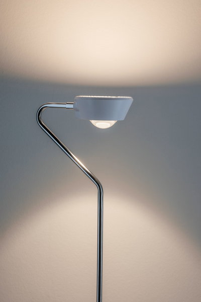 Modern floor lamp with white shade and chrome metal frame for stylish living room lighting