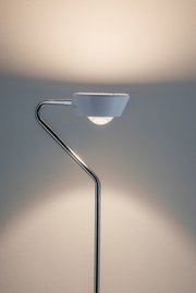 Modern floor lamp with white shade and chrome metal frame for stylish home lighting