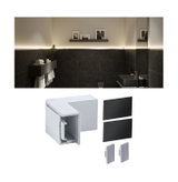 White plastic LED wall profile corner connector for indirect lighting in modern bathroom design.