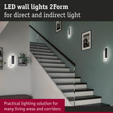 Modern black LED wall lights 2Form providing direct and indirect lighting in stairwell
