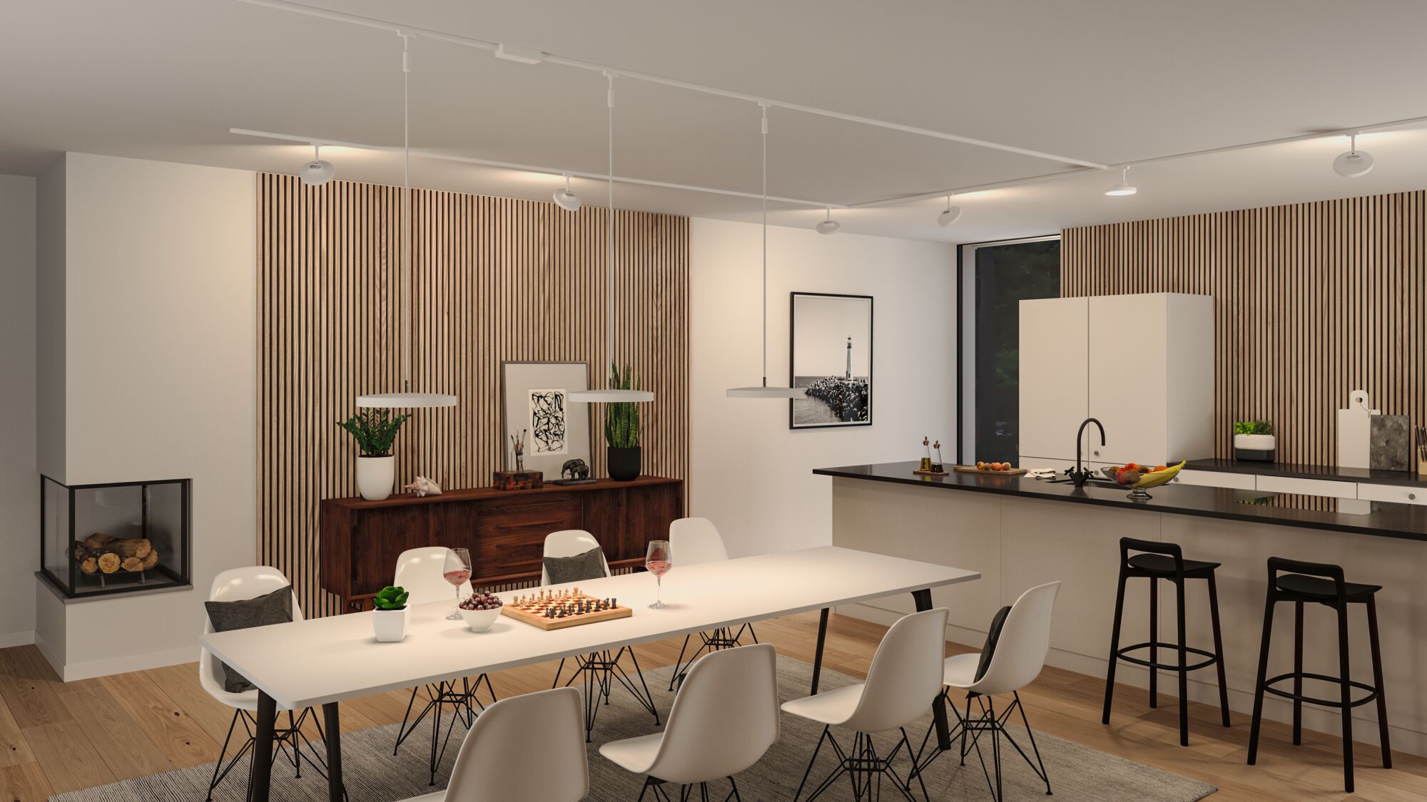 Modern white pendant lights above dining table in open kitchen with wood and black accents