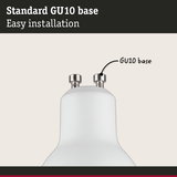 Close-up of white lamp with standard metal GU10 base for easy installation and lighting