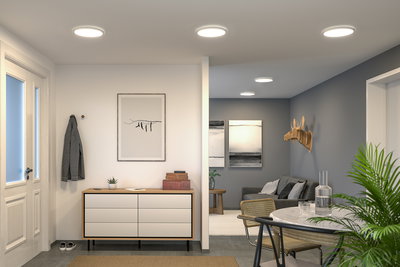 Modern living room with white round ceiling lights, grey wall and wooden decor for ambient home lighting