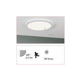 Round white ceiling light with built-in sensor and 180° motion detector for energy-saving lighting.