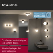 Gove series bathroom lights in matte black with white spherical shades, elegant bathroom lighting design