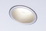 Round recessed LED downlight with silver aluminum frame and warm white light for living spaces