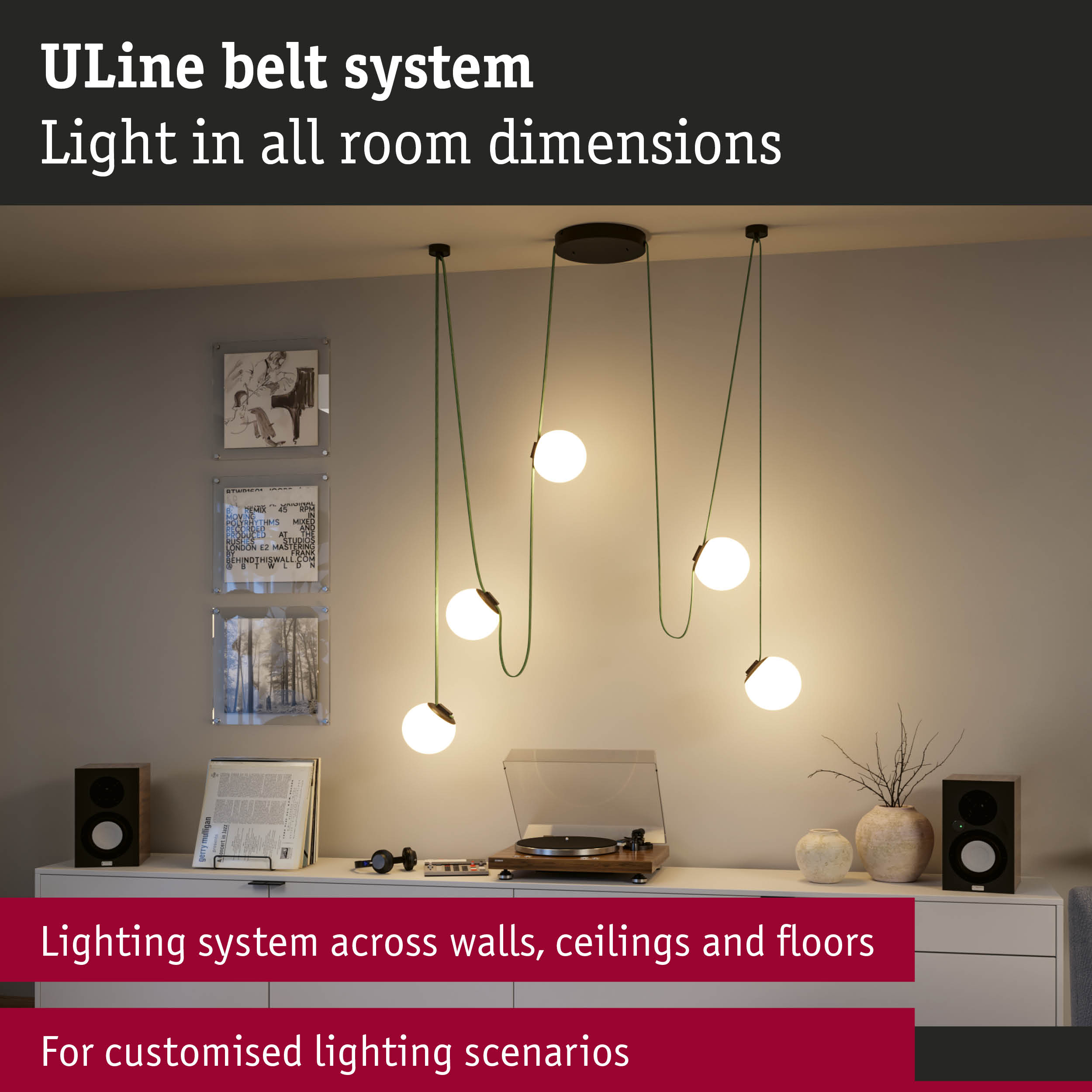 Modern ULine lighting system with white globe lamps and green cables in living room with turntable