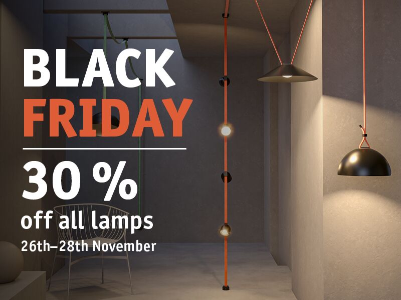 Black and grey designer pendant lamps with orange cords in modern room promoting lamp discount offer.