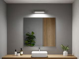 Modernes Badezimmer mit rechteckigem weißen Waschbecken auf Holzplatte und LED-Spiegelleuchte
