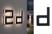 Modernes LED-Hausnummernlicht in Schwarz mit weißer Umrandung für Außenbeleuchtung und Hausnummern.
