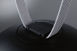Close-up of black plastic clip with grey fabric strap on a technical device.