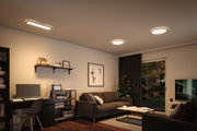 Modern living room with warm white LED ceiling lights and black sofa in urban style interior