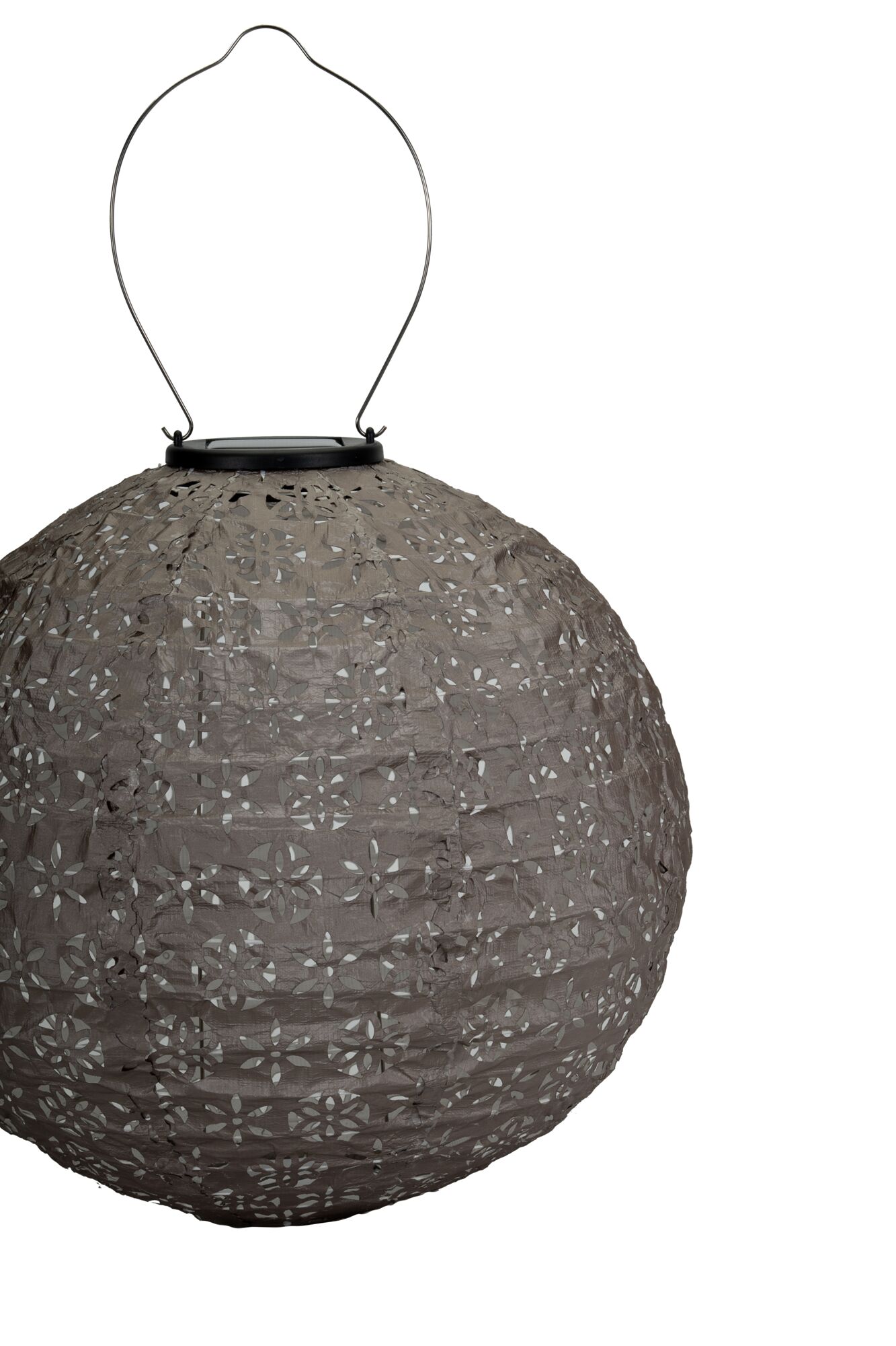 Round grey paper lantern with floral cutouts and metal handle for hanging, decorative lighting