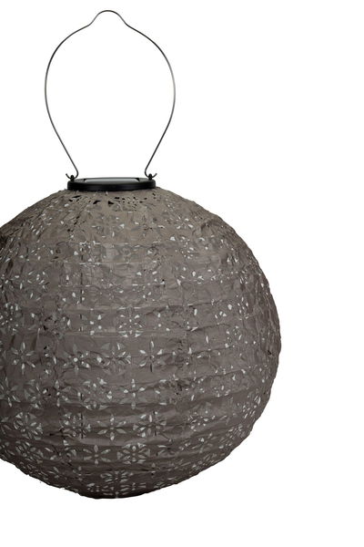 Round grey paper lantern with floral cutouts and metal handle for hanging, decorative lighting
