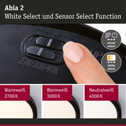 Abia 2 Schalter für White Select und Sensor Select Funktion an schwarzem Gerät mit Fingerbedienung
