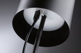 Black metal floor lamp with cable connection and white diffuser for modern living spaces.