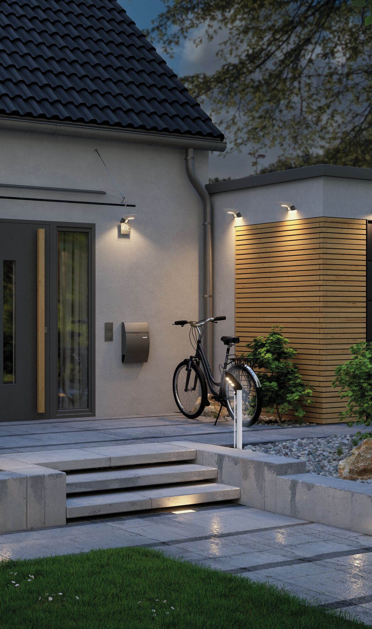 Modern outdoor LED wall and bollard lights at house entrance with bike and wooden facade paneling.