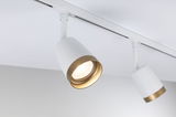 Modern white LED spotlight with gold trim on track system for focused room lighting