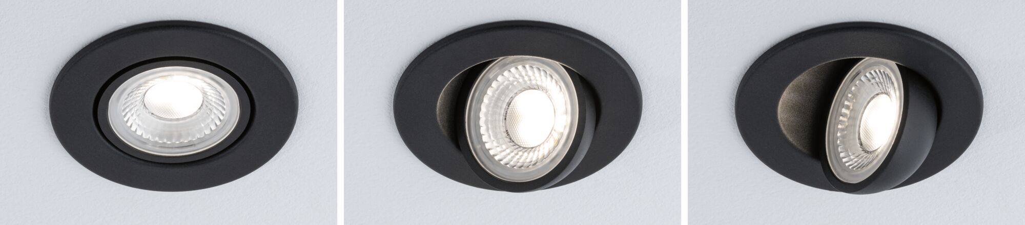 Drei schwarze Einbaustrahler aus Metall mit verstellbarem LED-Licht in Decke montiert