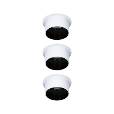 Three white recessed metal lights with black inner ring for modern LED lighting solutions