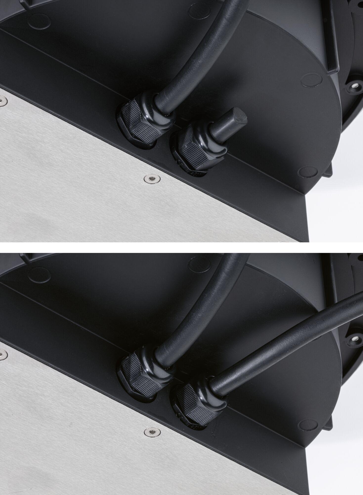 Close-up of black cable glands on black and silver metal housing for LED lighting fixture
