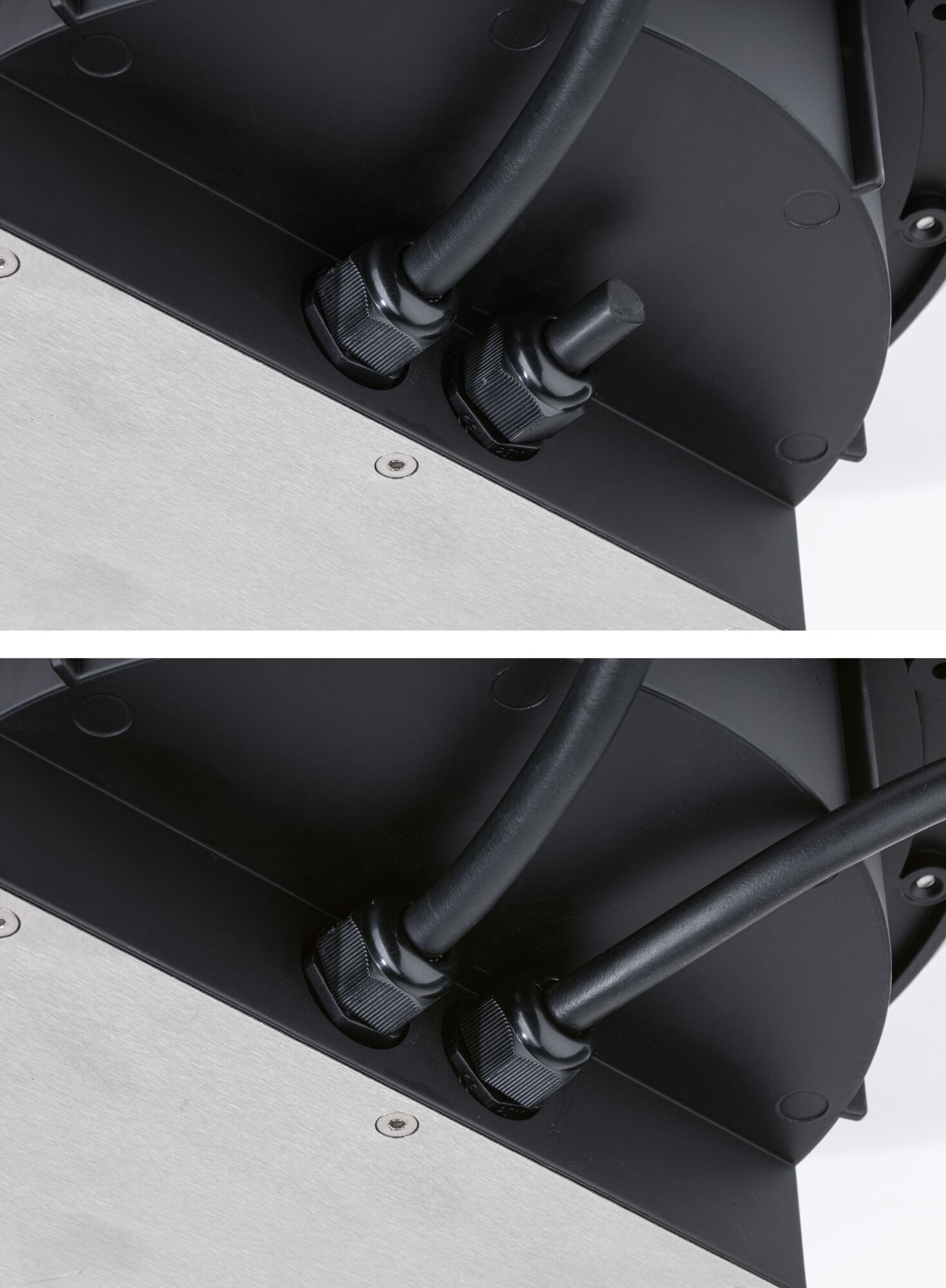 Close-up van zwarte kabelwartels op zwarte en zilveren metalen behuizing voor LED-verlichting