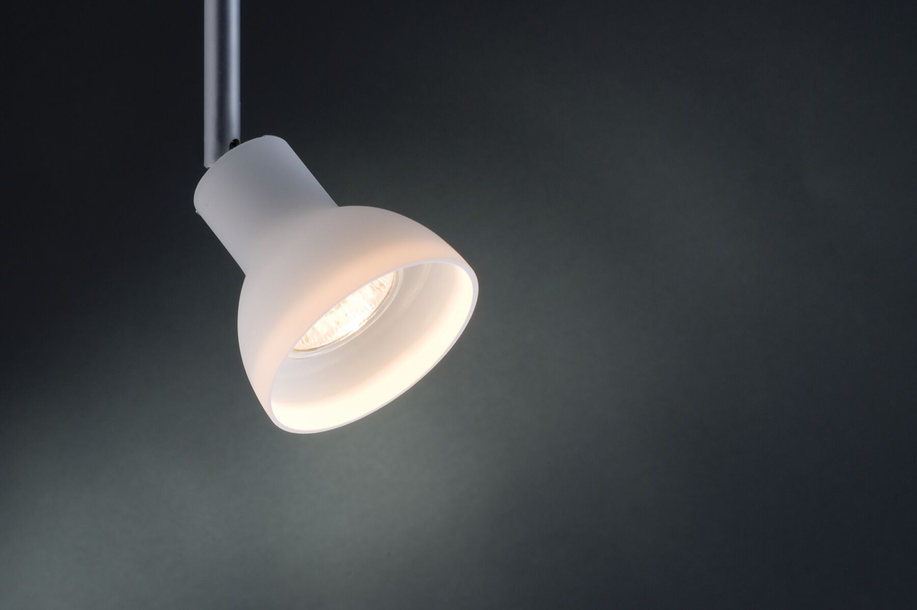 Modern white metal LED spotlight with adjustable head for focused lighting