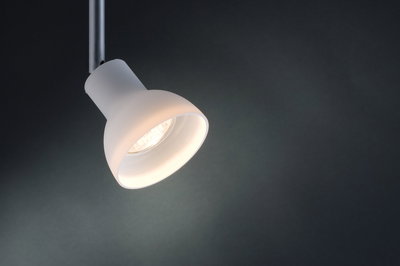 Modern white metal LED spotlight with adjustable head for focused lighting