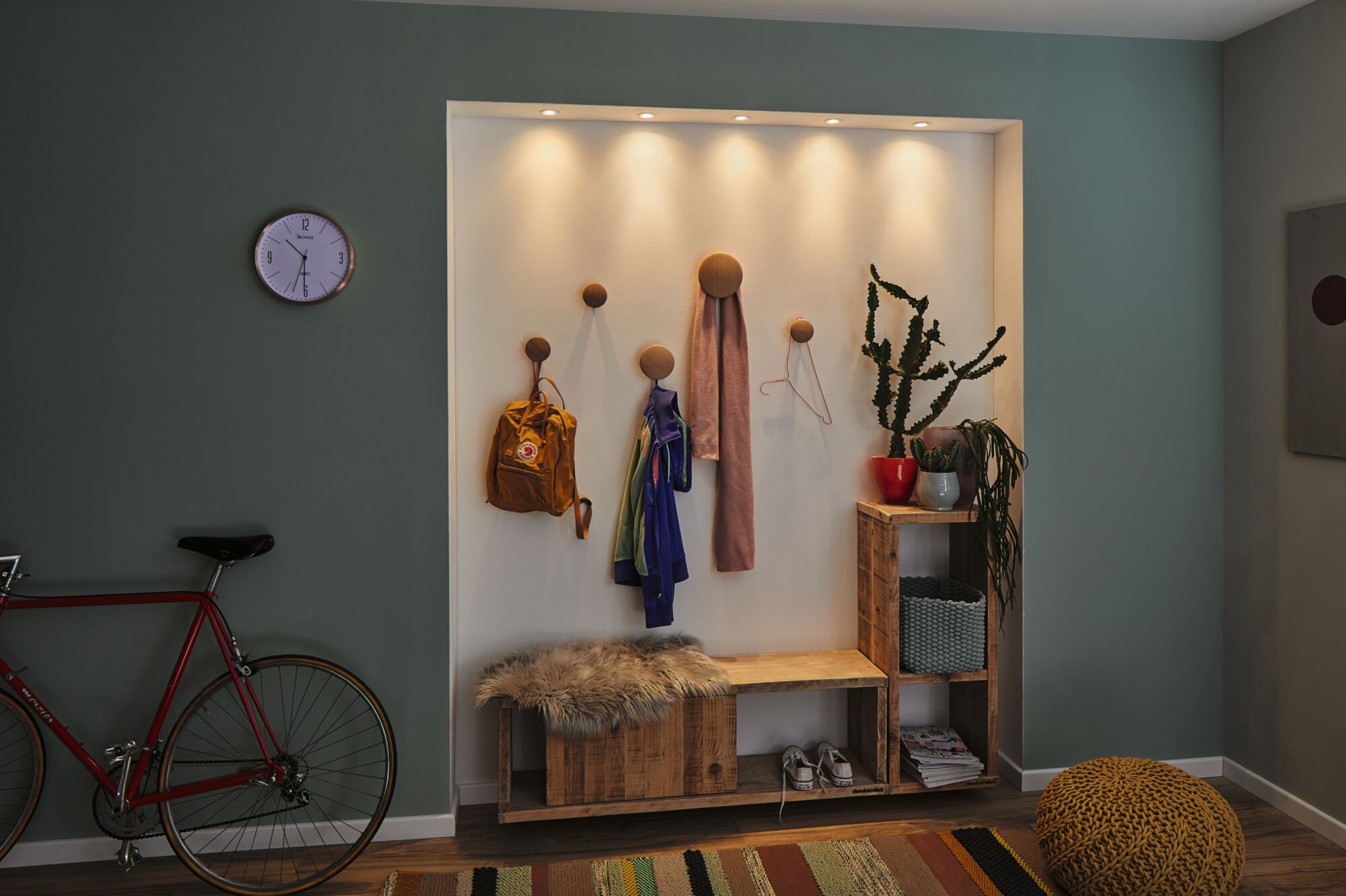 Entryway with wooden bench, wall hooks, warm white LED recessed lights, and green wall color