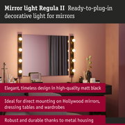 Matt black Regula II mirror light with metal housing and warm white LED bulbs for Hollywood mirrors