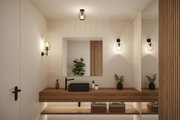 Salle de bain moderne avec lavabo noir, plan de travail en bois et appliques murales en verre transparent