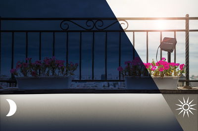 Moderner Außenstrahler in Schwarz beleuchtet pinke Blumen auf Balkon bei Tag und Nacht