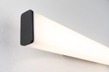 Modern LED wall light with black aluminum housing and white diffuser for home lighting